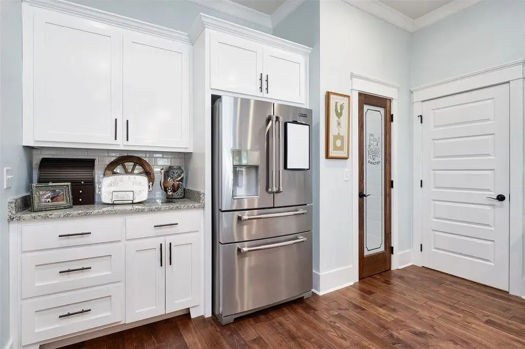 Spacious Family Home with Inviting Porches and Ample Garage Space