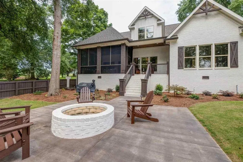 Spacious Family Home with Inviting Porches and Ample Garage Space